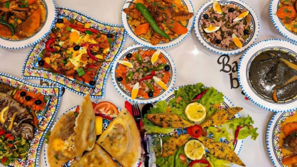 Tunisian cuisine unique — from the essential role of olive oil in daily dishes to the rich use of almonds in sweets and traditions