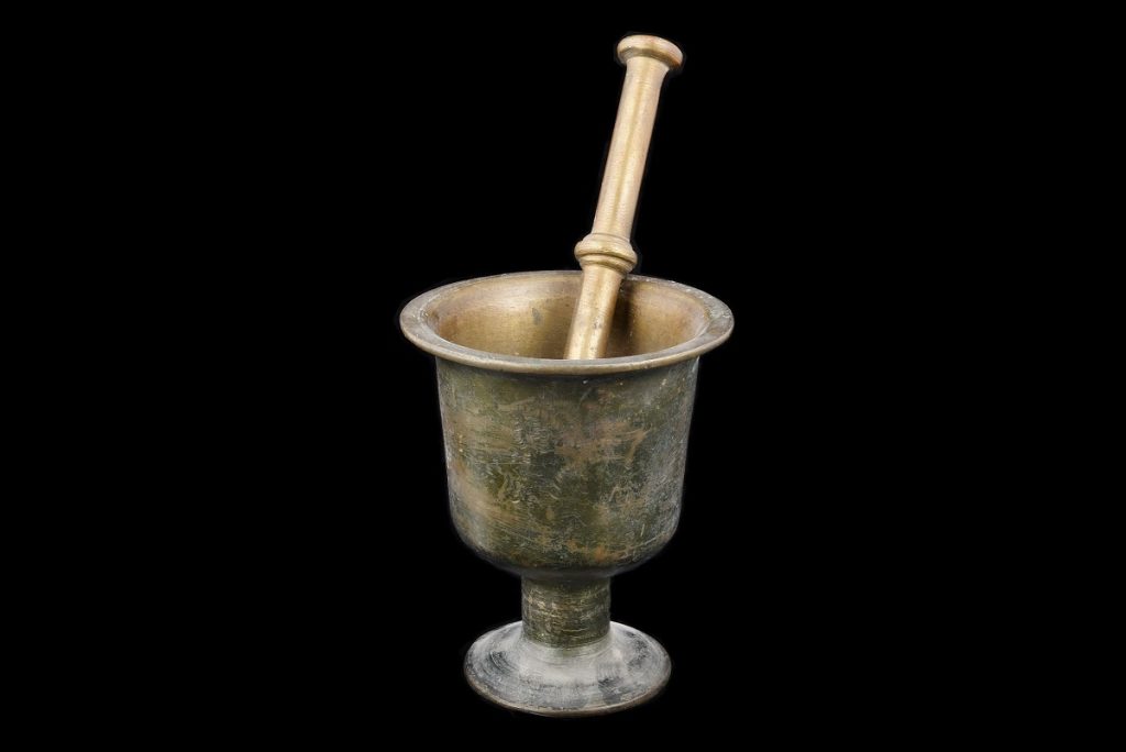 the traditional Arabic cooking tools — mortar, sieve, and saj