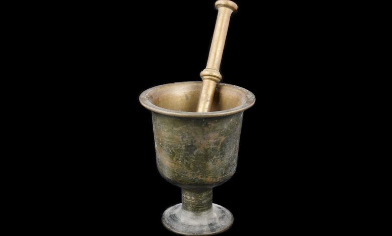 the traditional Arabic cooking tools — mortar, sieve, and saj