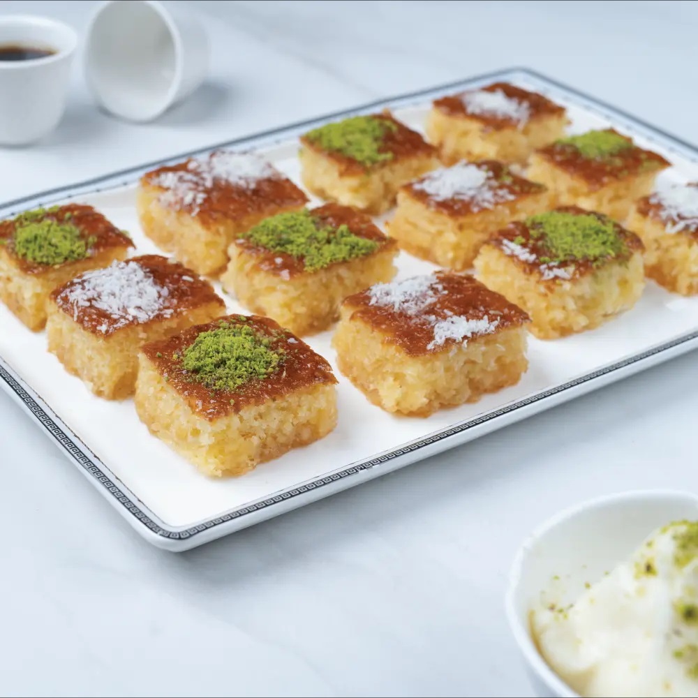 the history and flavors of Basbousa beloved Middle Eastern desserts