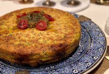 Makmoura is a traditional Jordanian dish made of chicken, onions, and dough, layered and baked to perfection.