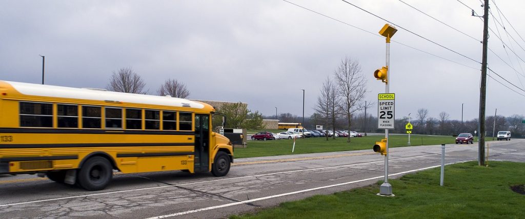 A school zone in Michigan covers an area within 1,000 feet of any school property in all directions. The law enforces special traffic rules within this range to protect children walking or biking to school.