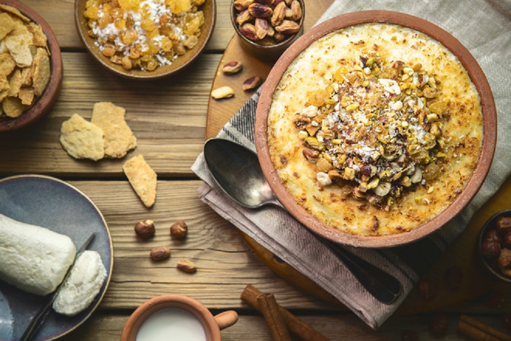 A beloved Egyptian dessert, Umm Ali is a rich bread pudding made with layers of pastry soaked in hot milk or cream, then topped with nuts and dried fruits.