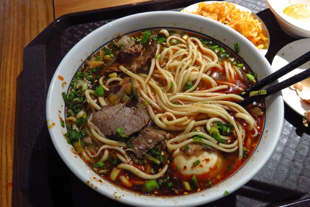 Halal Chinese noodle soups have gained popularity in major U.S. cities such as New York, Chicago, and Los Angeles. These soups feature slow-braised halal beef, aromatic spices, and hand-pulled wheat noodles, inspired by Hui Muslim cuisine.